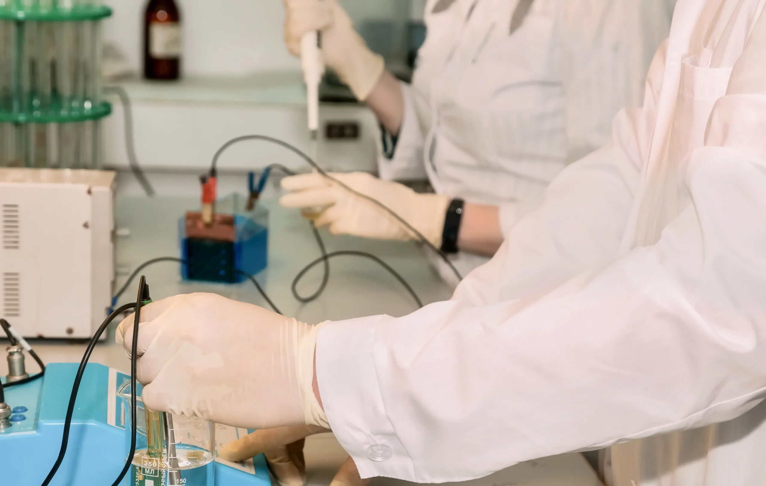 Specialist extracting an oil sample from a power transformer for Dissolved Gas Analysis